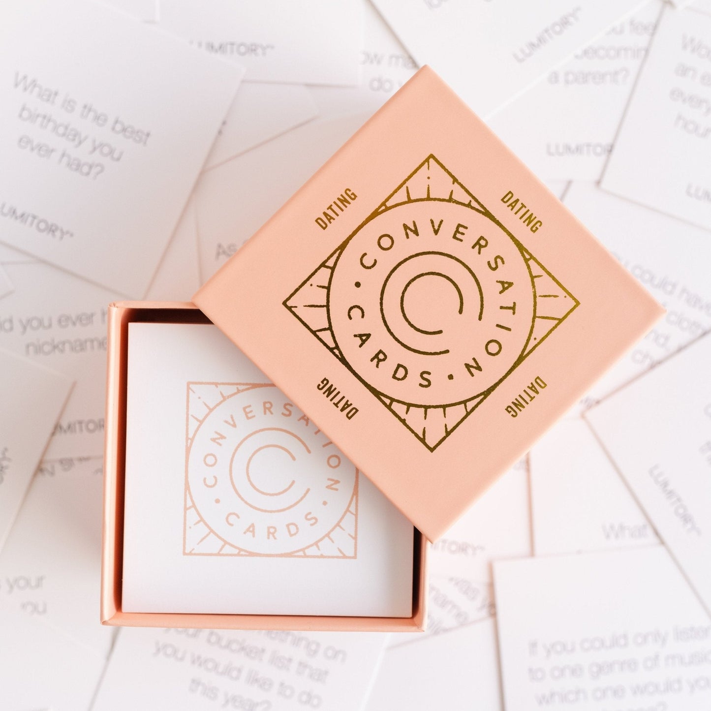 Pink "Conversation Cards Girls Night" box with card stack inside. Sizes available: standard deck.
