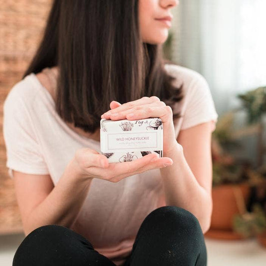 The product is a "Wild Honeysuckle Soap - Bath Bar". It's a compact size, perfect for holding in your hands.