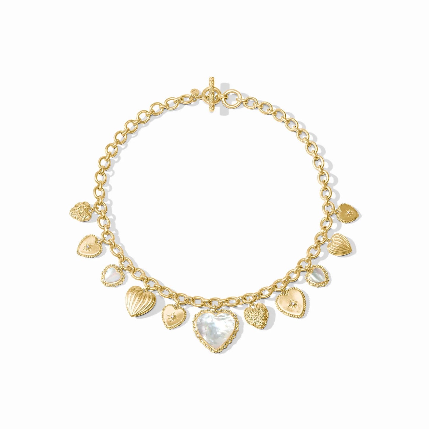 Gold chain necklace with textured gold and white mother of pearl heart charms, toggle clasp. Available in 16" and 18" lengths.