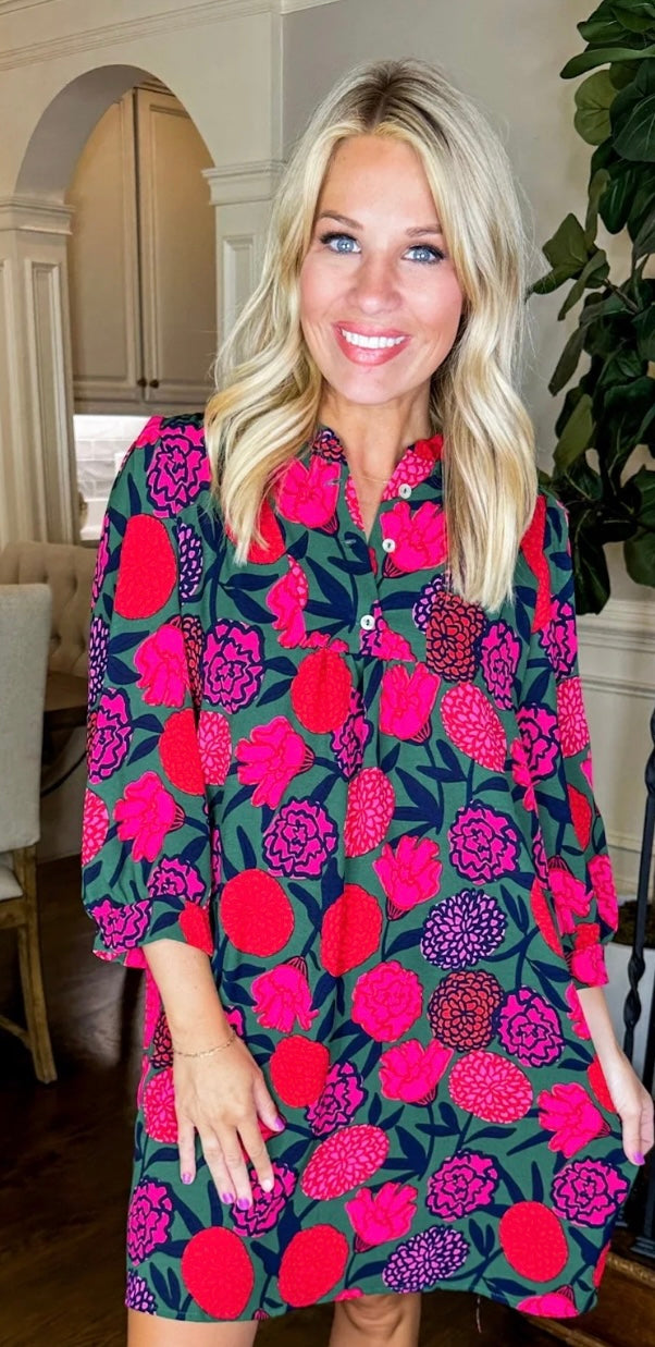 Karis Make You Mine Dress:
- Knee-length floral dress
- Bold patterns in pink and red
- Ruffle collar
Sizes available: XS, S, M, L, XL