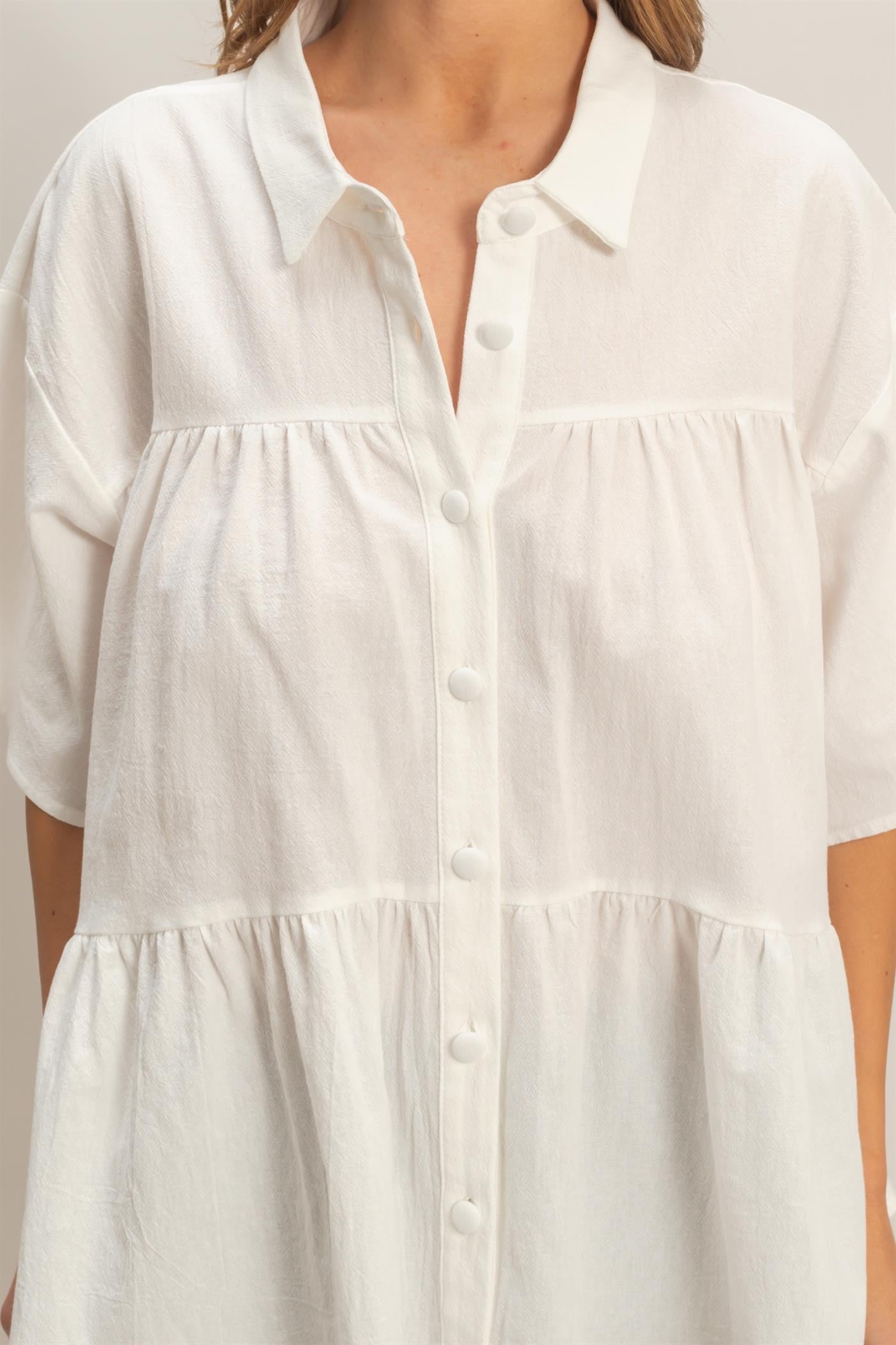 White cotton Button-Front Tiered Top with collar, short sleeves, gathered detail; available in sizes XS-XXL.