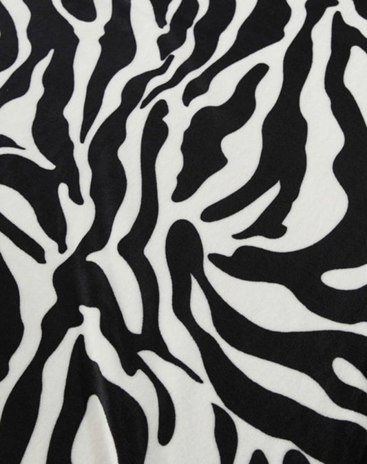 Zebra Print Super Soft Blanket in black and white wavy stripes; available in Twin, Full, Queen, and King sizes.