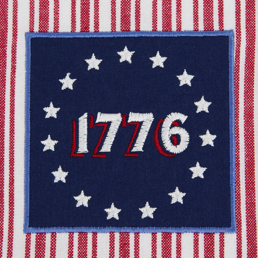 Betsy Ross Dishtowel: blue square with “1776,” 13 white stars, red/white stripes. Sizes available: standard kitchen towel.