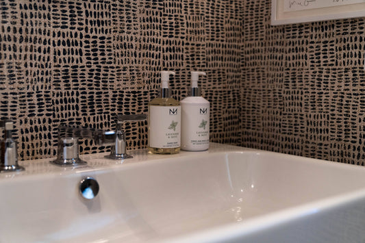 Lavender & Mint Hand Soap dispensers, paraben-free and cruelty-free, shown. Available in 8oz and 16oz sizes.