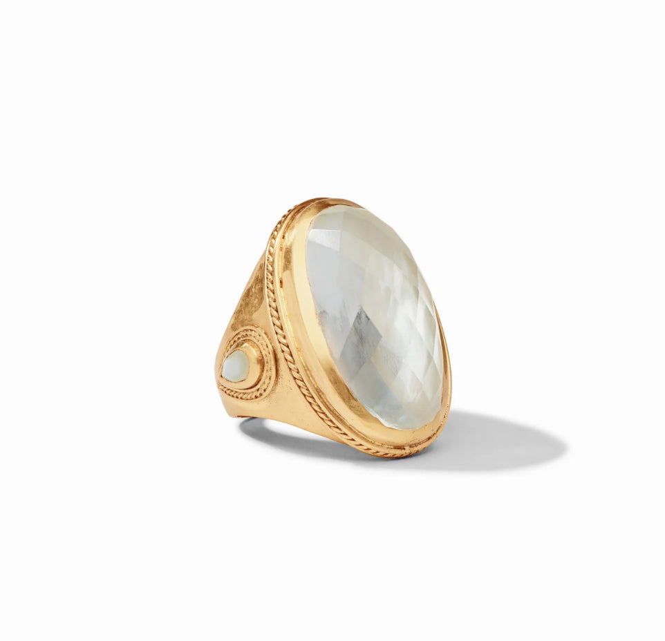 Gold-plated ring with large iridescent clear gemstone, small pearl accent. Available sizes: 6, 7, 8.