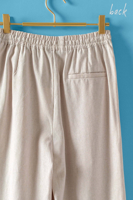 Natural Linen Blend Wide Leg Drawstring Pants with elastic waistband, single back pocket. Available in sizes XS-XL.