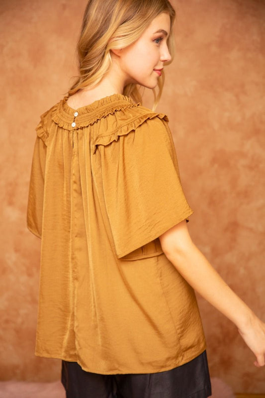 Ruffle Round Neck Golden Top with short wide sleeves, ruffle details, and back buttons. Available in sizes XS–XL.