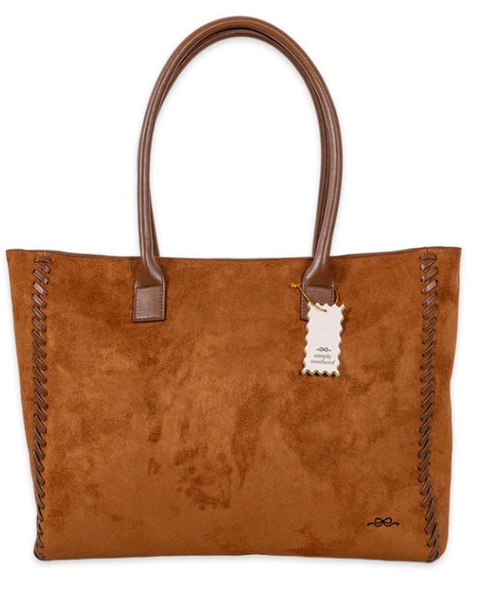 Brown suede tote bag with leather handles, decorative edge stitching, and a small hanging tag. Spacious design for daily use. Available in small, medium, and large sizes.