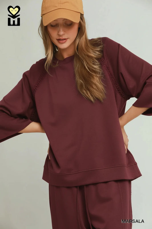 Marsala Butterfly Lace Raglan Sleeve Top: loose brown sweatshirt with subtle raglan sleeves. Available in sizes XS–XL.