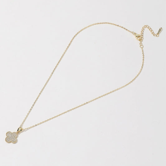 14K gold dipped quatrefoil pendant necklace with CZ stones; small clover design. Available in 16", 18", and 20" lengths.
