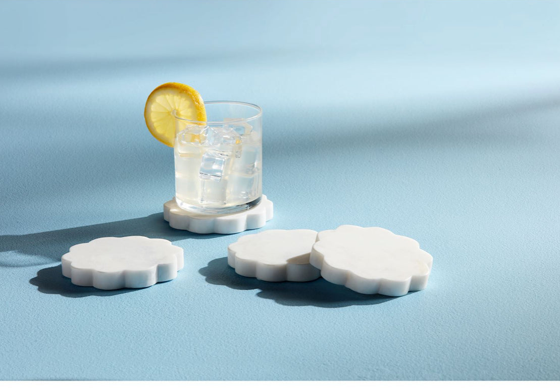 4-inch white marble beaded coaster set, cloud-shaped; available as a set of four.
