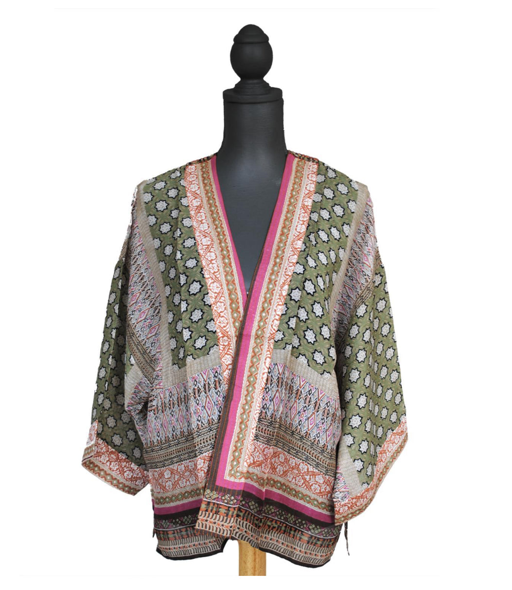 The Moorish Pattern Short Kimono: Stylish kimono crafted in Sheffield, England with green, pink, cream, and black colors featuring intricate floral and geometric designs. Wide three-quarter-length sleeves and open front. Available sizes: S/M, L/XL.