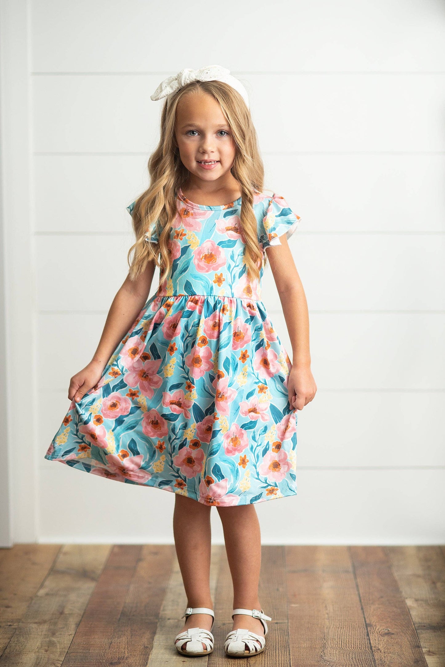 Pink floral print twirl dress. Available in sizes 2T-10Y.