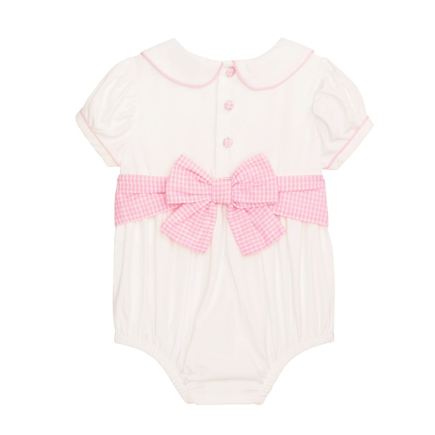 White baby romper with pink trim, large gingham bow, Peter Pan collar, pink back buttons. Sizes: NB-24M.