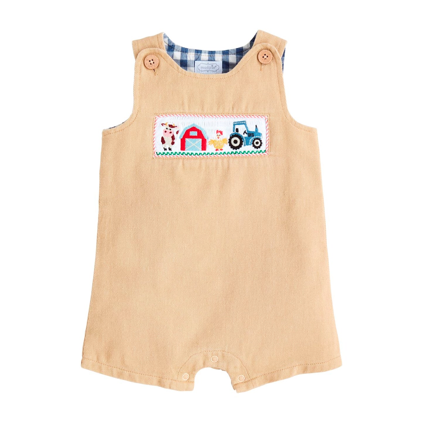 Tan toddler romper with shoulder buttons, blue gingham lining, embroidered farm patch. Sizes: 12M-3T.