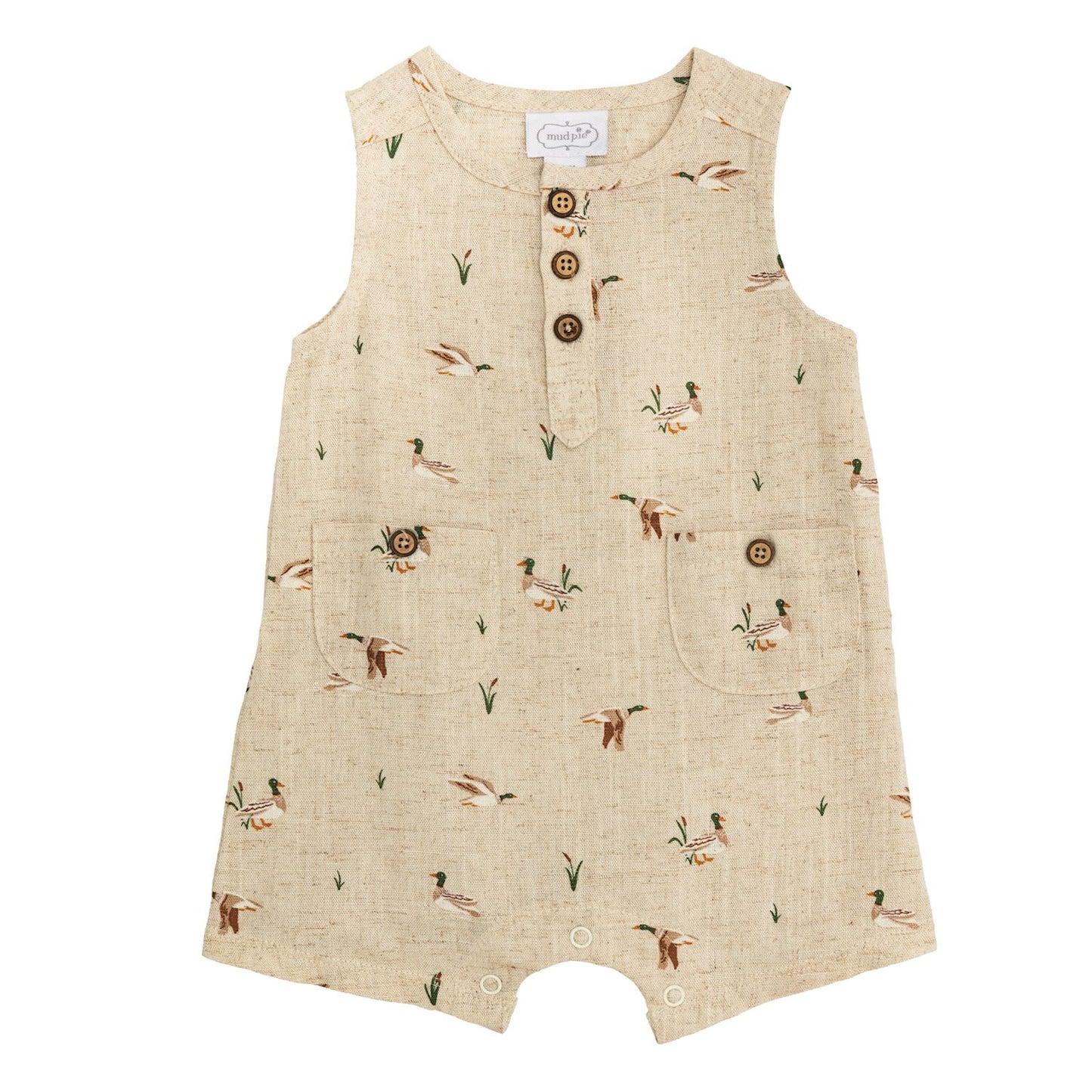 Beige linen infant shortall with duck and plant print, front pockets, coconut buttons. Sizes available: newborn to 24 months.