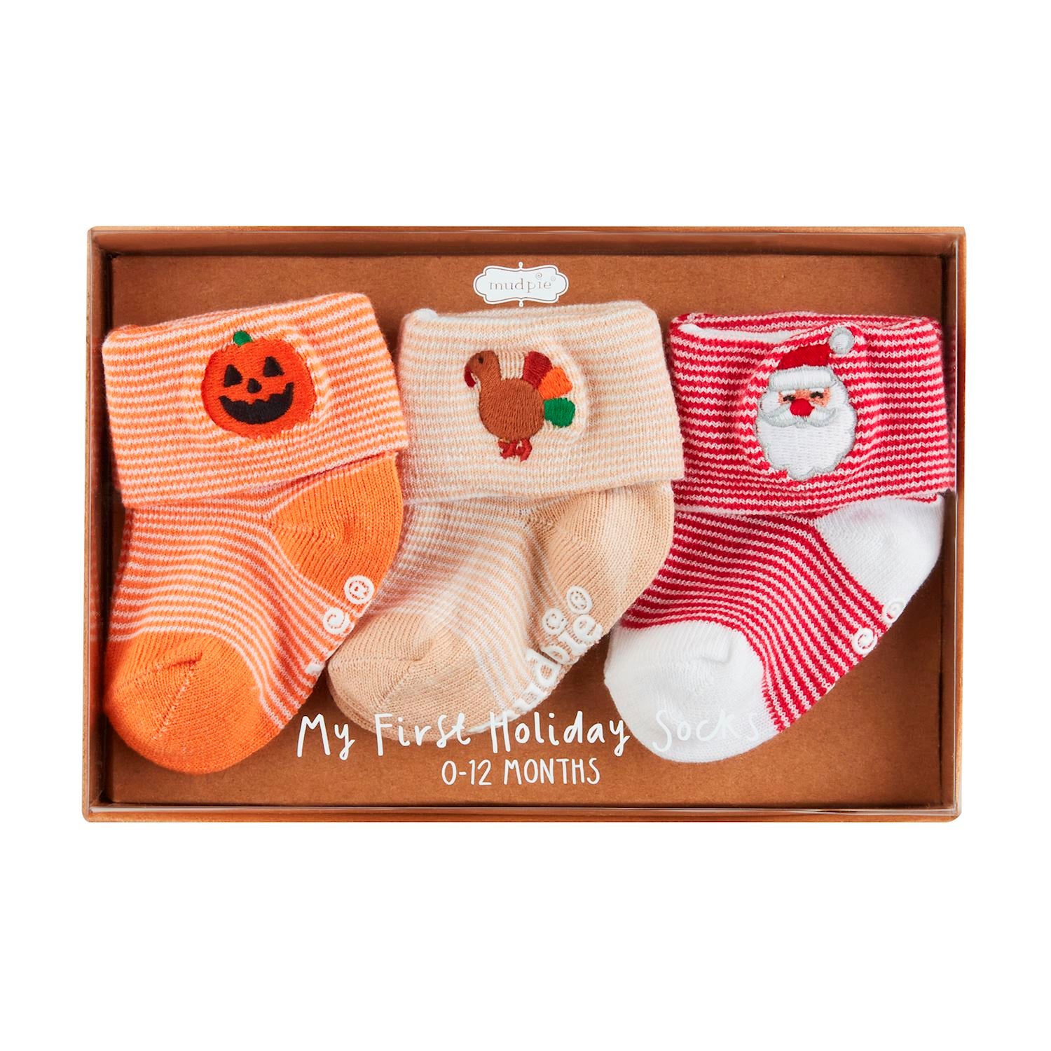 **My First Holiday Sock Set**
Three pairs of cotton hosiery socks for ages 0-12 months. Includes:
- Orange pair with pumpkin (Halloween)
- Beige pair with turkey (Thanksgiving)
- Red and white striped pair with Santa Claus (Christmas)