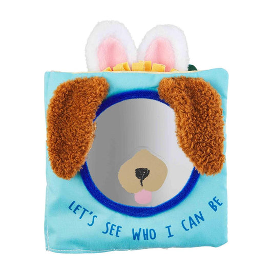 Front of baby book. Blue background with mirror in the middle with dog nose and 3D plush dog ears. Says "Let's See Who I Can Be"