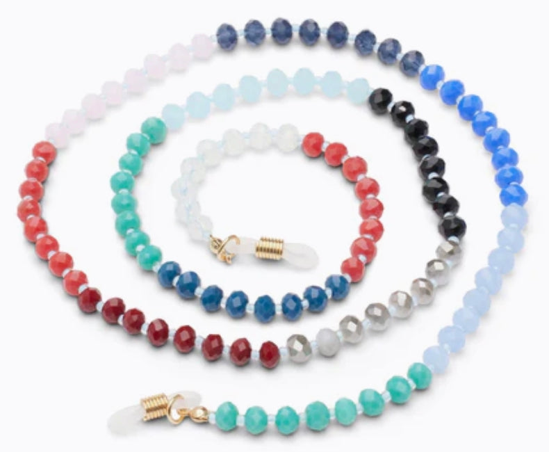 The Peepers Beaded Chain necklace is adorned with concentric loops of faceted beads in blue, red, green, and white colors. It has golden clasps and clear attachments. Available sizes: 18", 20", 22".