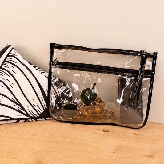 The Palisade Pouch: clear PVC, black trim, easy-clean. Holds essentials. Available in small, medium, large sizes.