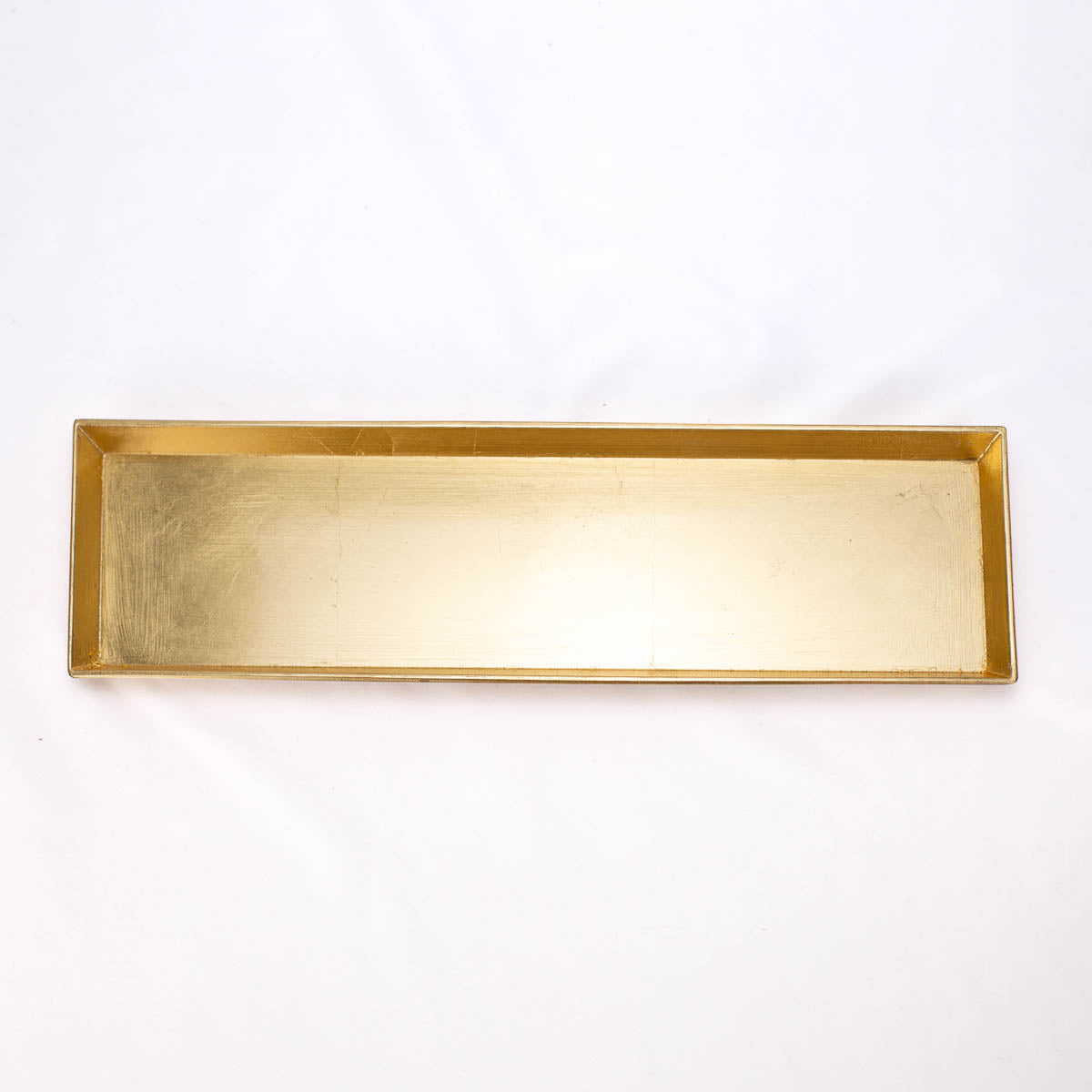 Rectangular gold-colored polypropylene tray with raised edges, available in multiple sizes.