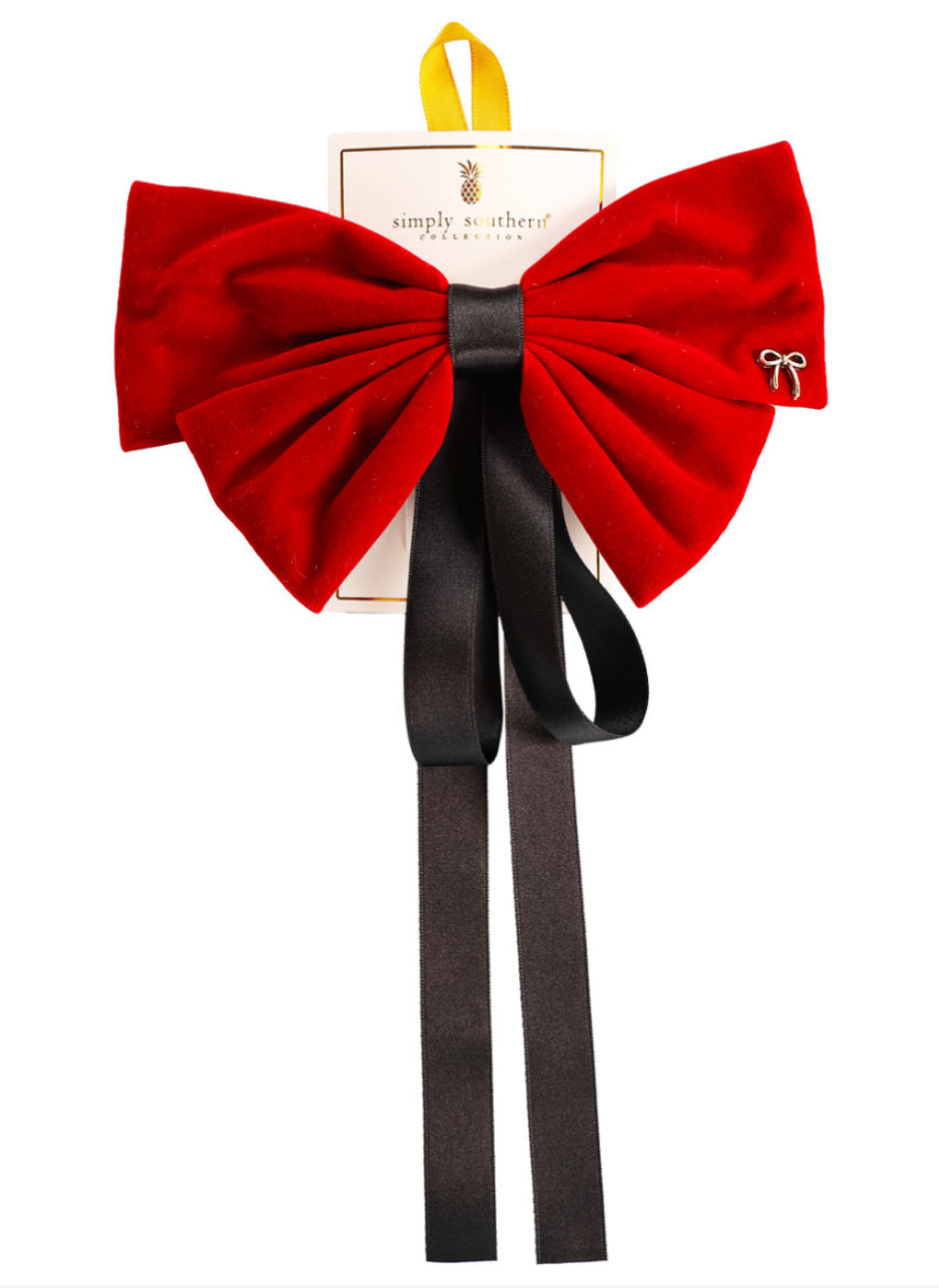 Large red velvet bow hair accessory, long black tails, small silver bow pin. Available in large size.