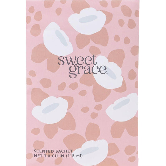 Pink Sweet Grace Sachet, white and beige floral design, 7.0 CU IN (115 ml) size. "sweet grace" in gray letters on front.