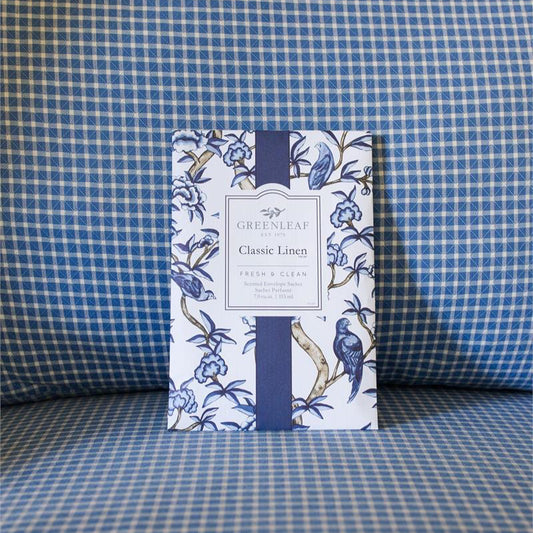 The Classic Linen Sachet features a blue floral and bird design; available in small, medium, and large sizes.