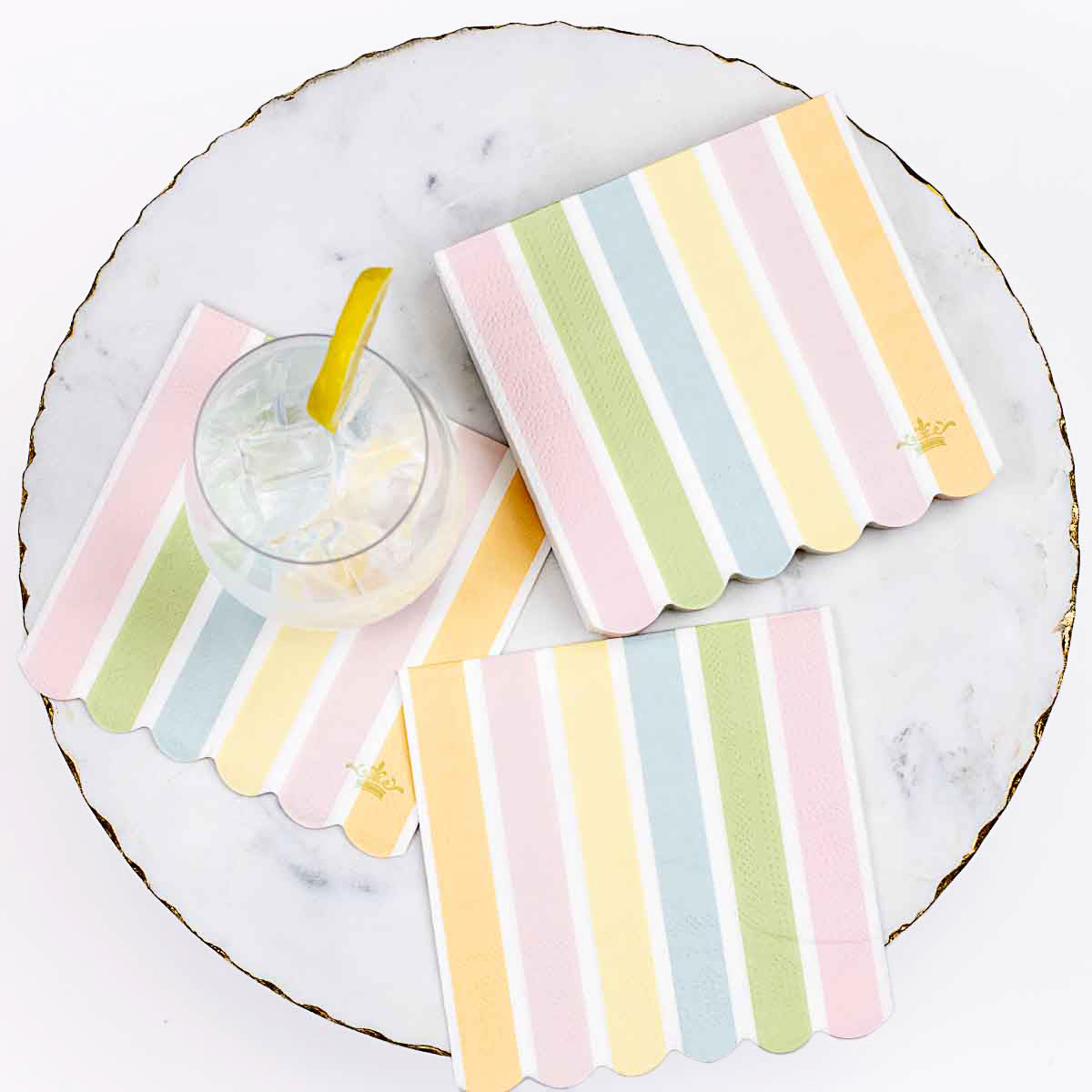 Candy Stripe Scalloped Cocktail Napkins in pink, yellow, green, blue. Available in standard cocktail napkin size.