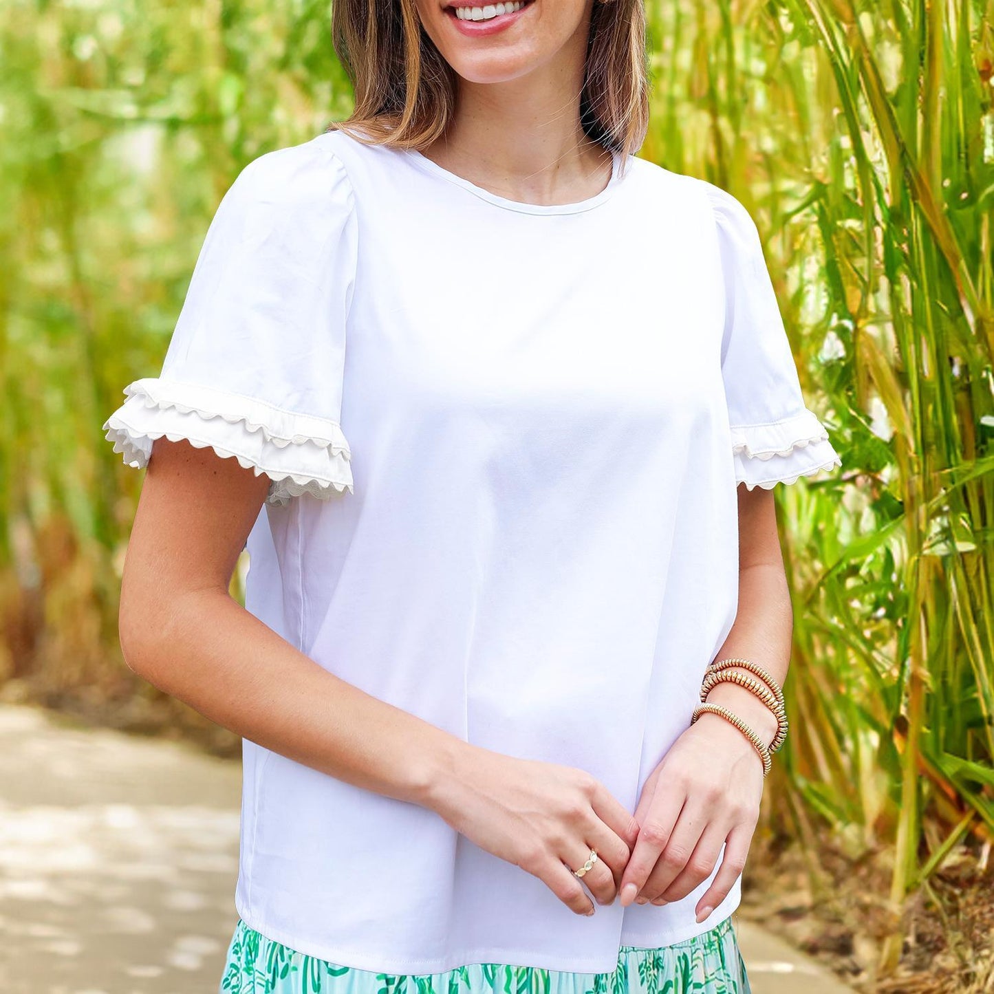 Cassidy White Top: Features ruffled sleeves. Available in sizes XS, S, M, L, XL.
