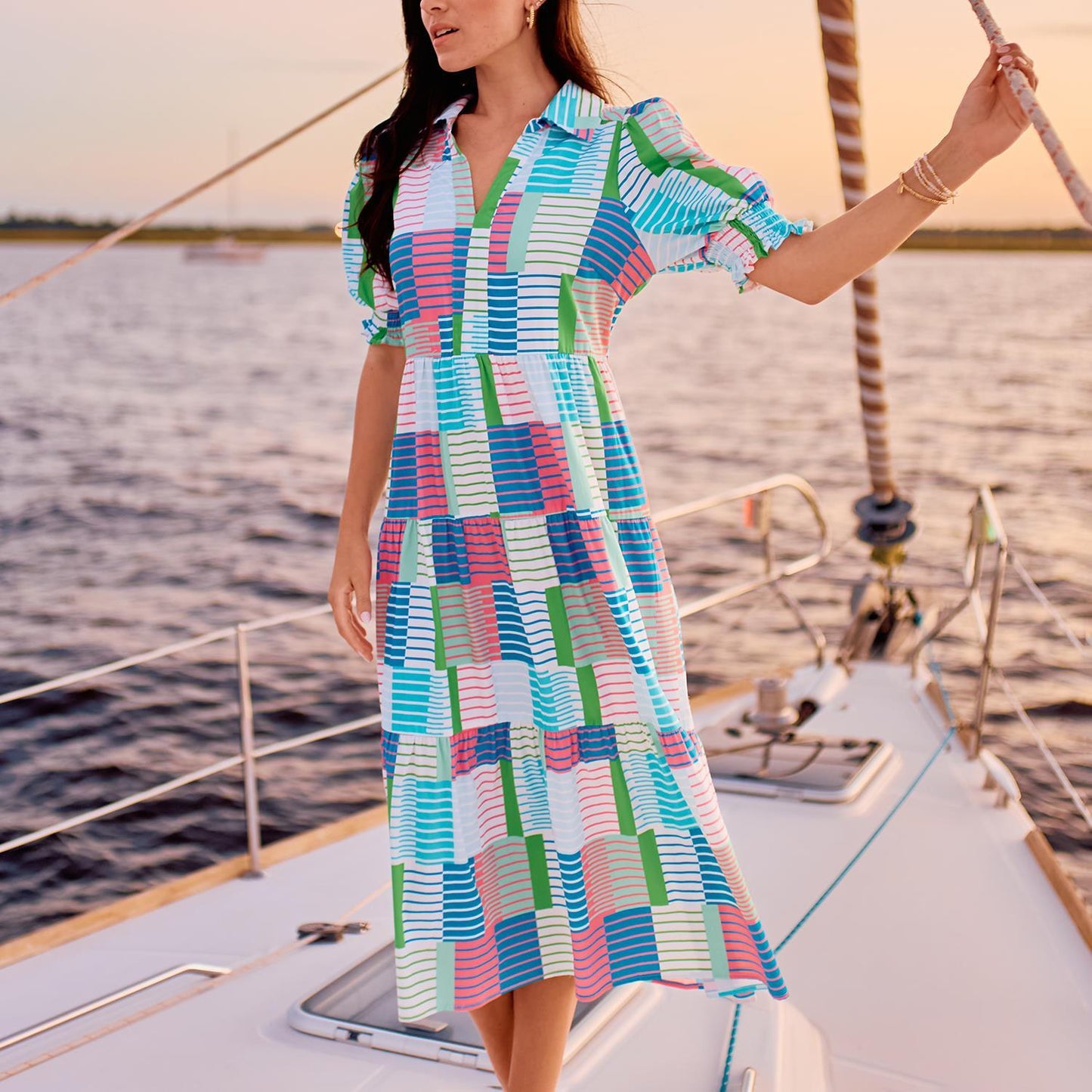 Molly Dress: Vibrant dress with smocked short puff sleeves. Available in sizes XS, S, M, L, XL.