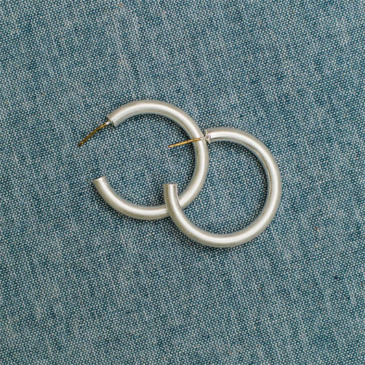 Cameron Earrings: sleek silver hoops, available in multiple sizes. Minimal design, polished finish.