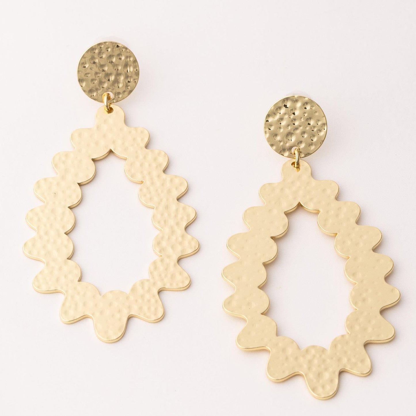 The Miranda Gold Earrings: gold-tone, round hammered studs, large scalloped oval dangles, textured finish. Sizes: S/M/L.