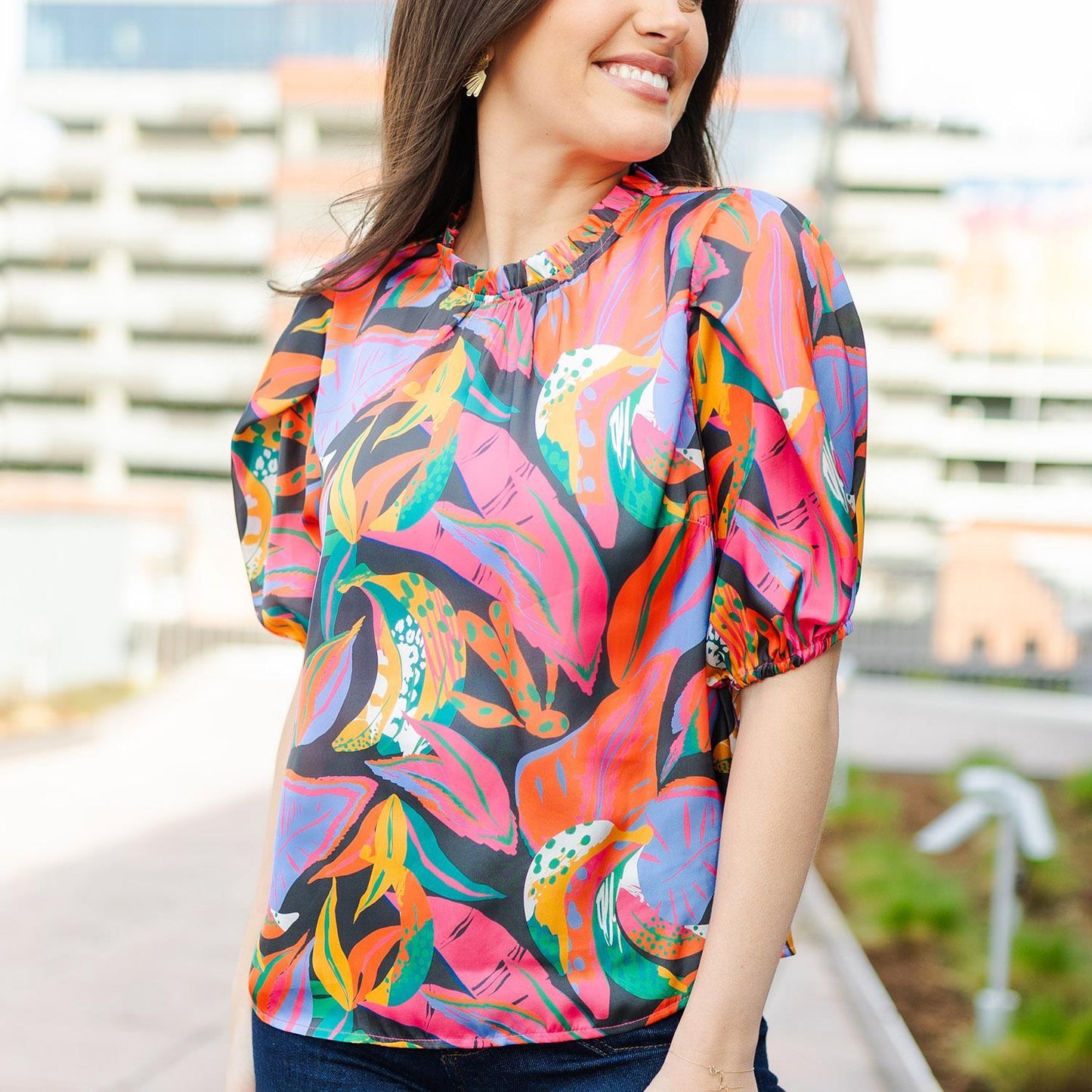 Libby Eyes on Me Top with abstract floral patterns. Sizes: S, M, L.