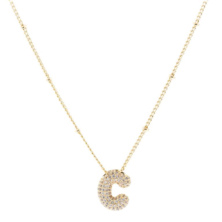 The Chloe Necklace showcases a "C" pendant adorned with sparkling stones on an 18K gold-plated chain. Available sizes: Adjustable length.