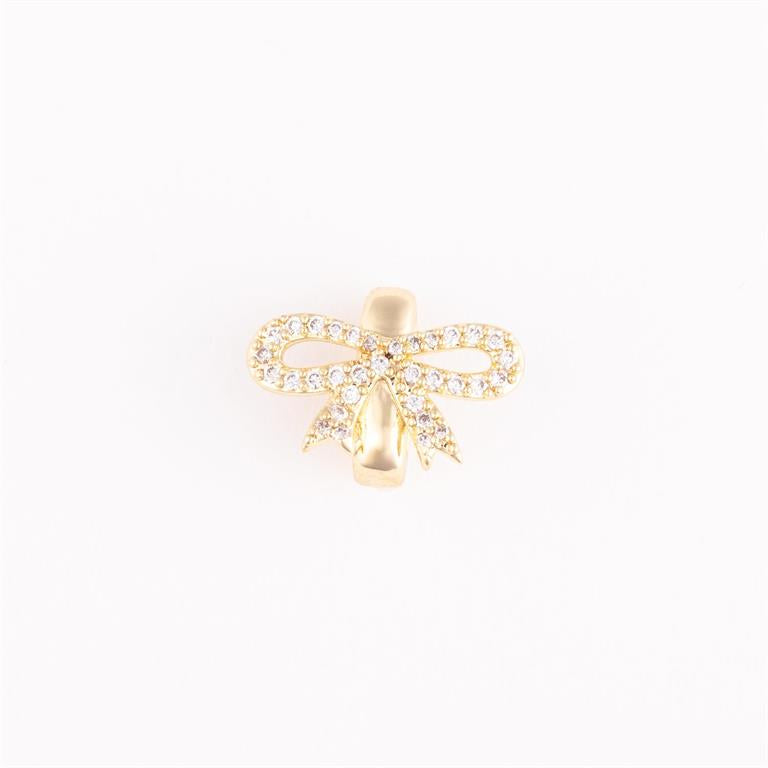 Gold bow-shaped bracelet charm with clear stones. Elegant, timeless design. Available sizes: S, M, L.