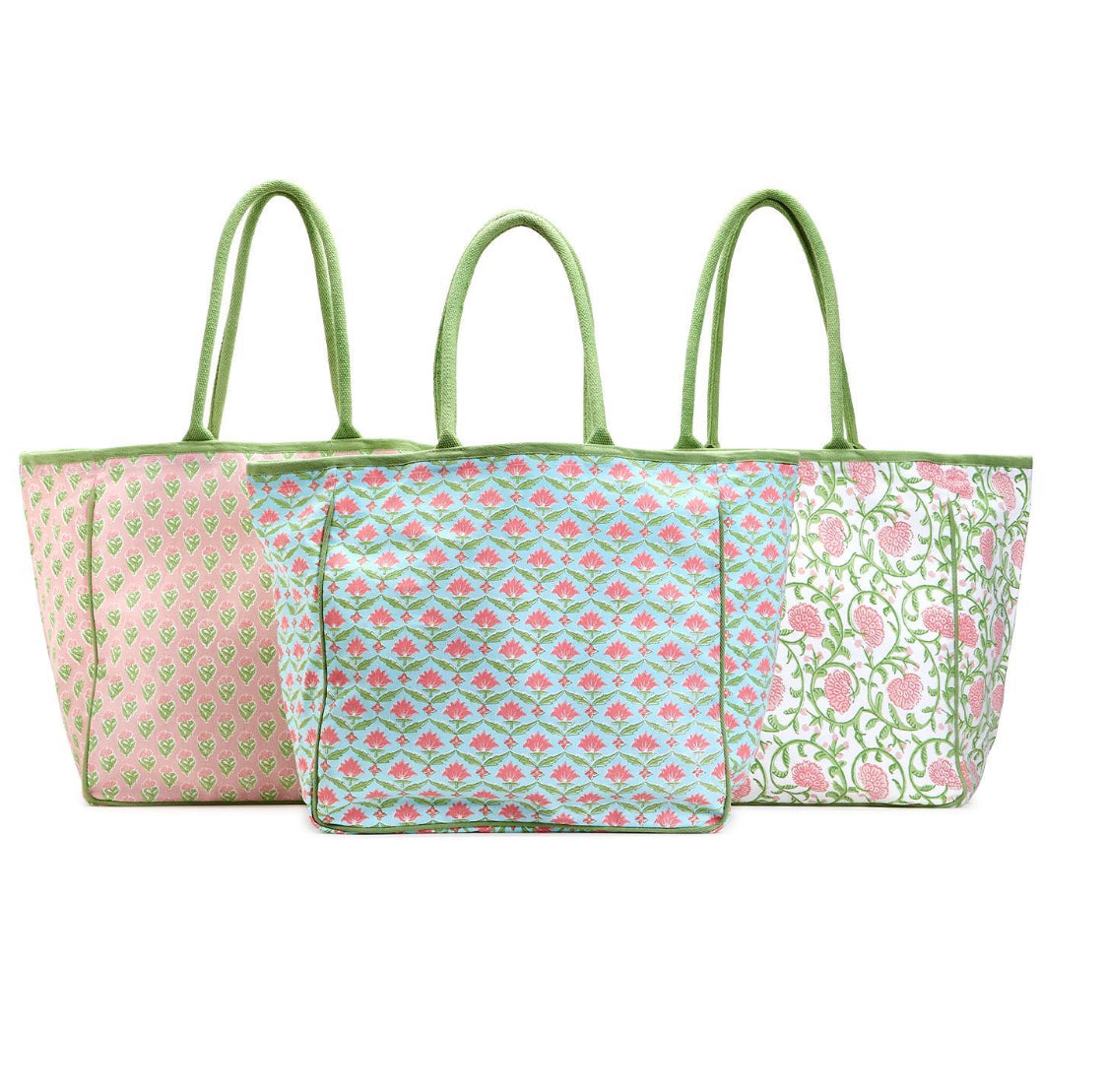 Floral block print tote bags with green handles in assorted pastel designs. Foldable, available in small, medium, large.