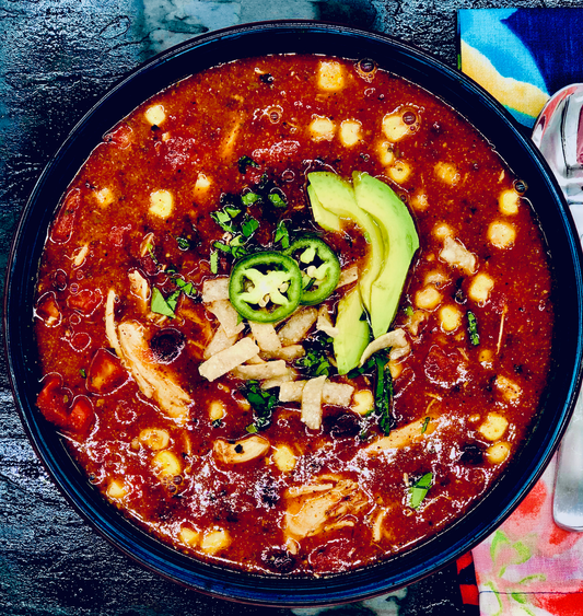 Chicken Tortilla Soup Mix with hominy, chicken, avocado, jalapeño, tortilla strips, and cilantro. Available in 16oz and 32oz.