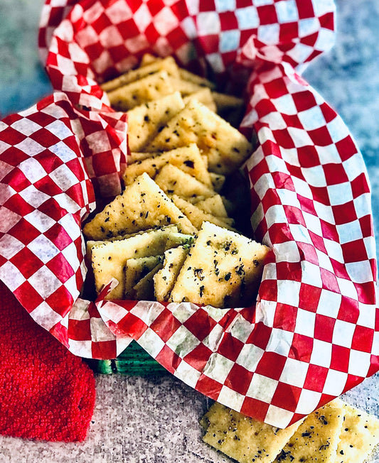 Square crackers coated in Buttermilk Ranch Cracker Seasoning. Available in small, medium, and large basket sizes.