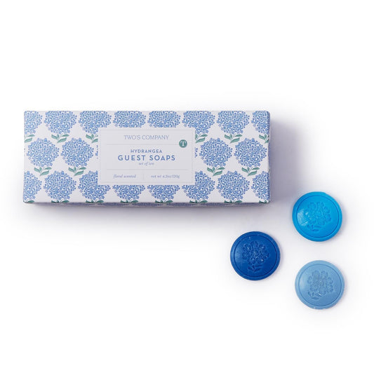 Hydrangea Set of 10 Soap" is a box containing ten floral-embossed soap discs. Each soap is delicately designed with beautiful blue hydrangea imprints, enhancing its aesthetic appeal. The soaps are small-sized, perfect for hand washing or travel use.