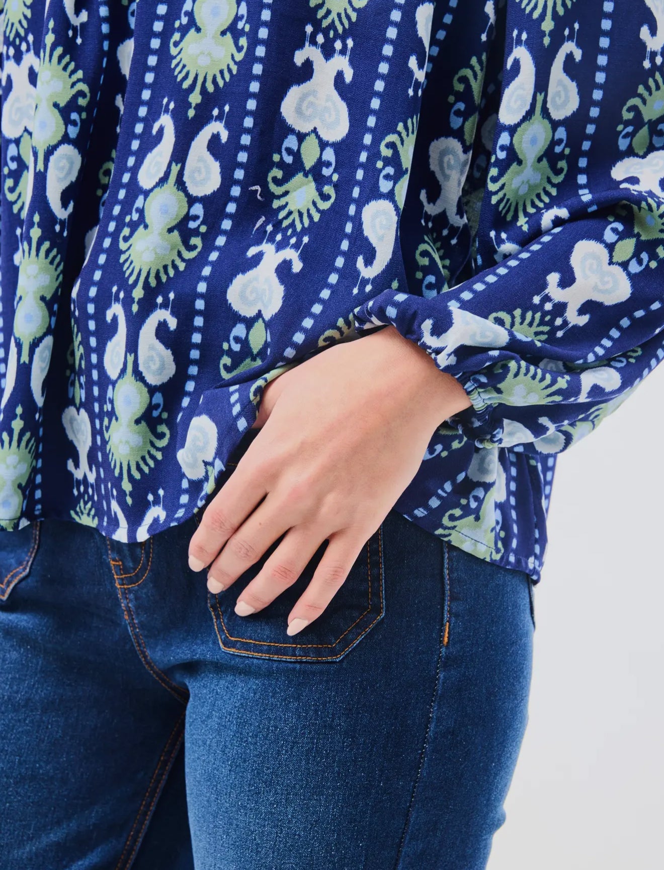 Janelle Top Ikat Stripe: blue patterned, long-sleeve, notched neckline. Available in XS-XL.
