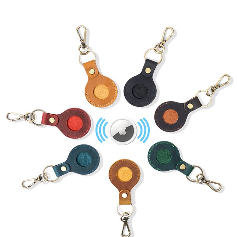 Seven vibrant Genuine Leather AirTag keychains, available in multiple sizes, shown to display available color options.