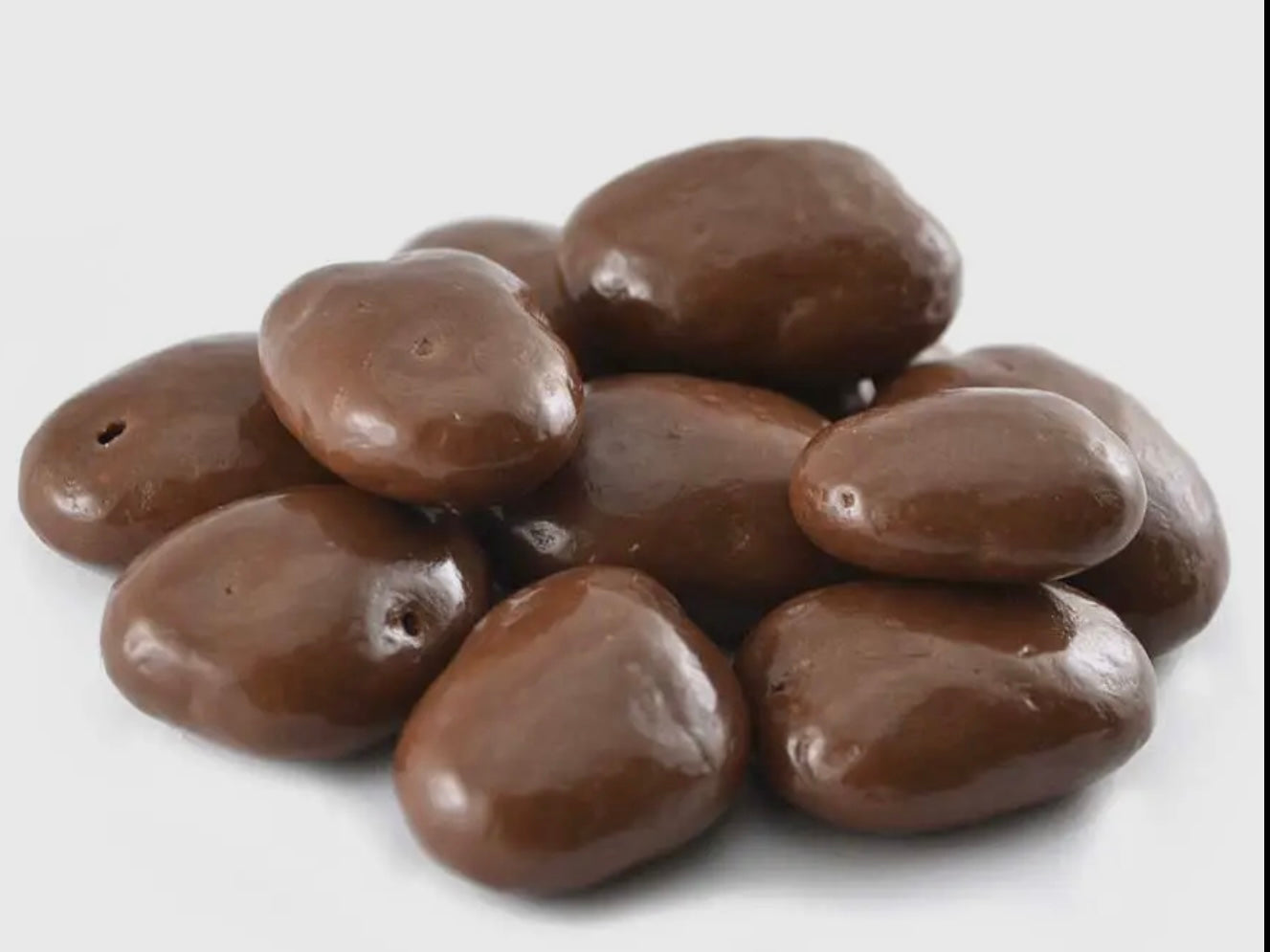 Chocolate Pecans, glossy and oval-shaped, coated in chocolate. Available size: 3.5oz.