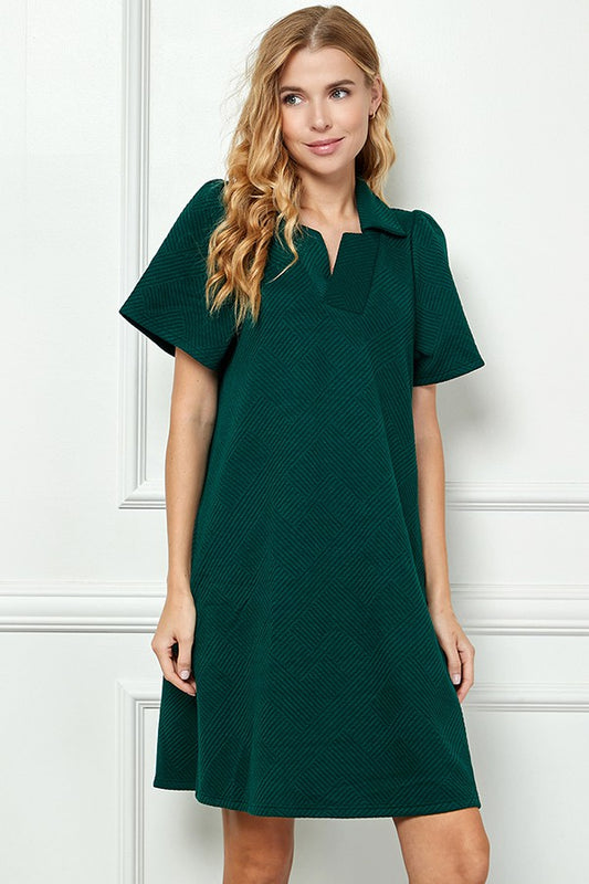 Emilie Collared Textured Dress in dark green, textured, short-sleeve, knee-length. Available in sizes XS-XL.