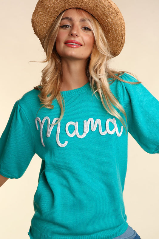 A cheerful woman wearing a straw hat and a bright turquoise Mama Embroidered Pop Letter Short Bubble Sleeve Sweater - Plus, posing against a neutral background.