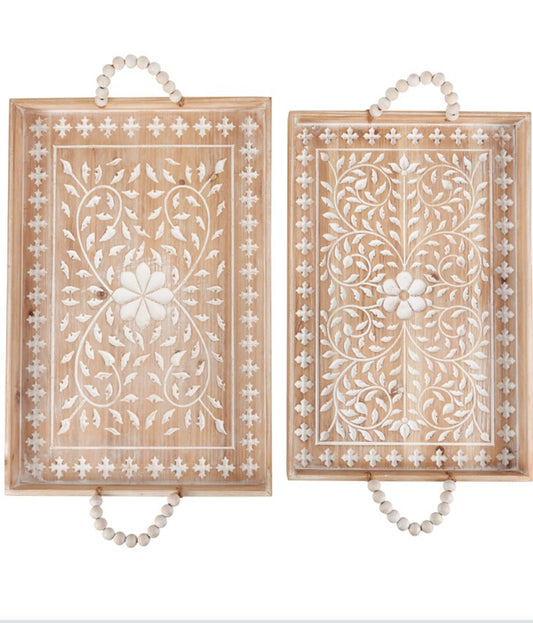 Set of two rectangular wooden trays with white floral patterns, beaded handles. Available in small and large sizes.