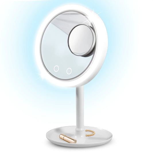 Round illuminated LED mirror with fan and smaller magnifying mirror attached. Main mirror emits soft white light. Mounted on white stand with circular base. Ideal for travel or touch-ups.
**Sizes Available:**
- Diameter: 15 cm / 5.9 inches
- Height: 20 cm / 7.8 inches