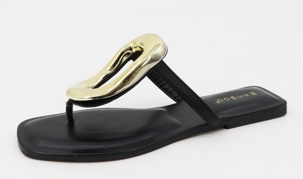 Black flat women’s sandal with square toe, metallic gold abstract front strap, thong design, cushioned insole, and gold "BABOOSH" logo near the heel. Available sizes: 36-41.