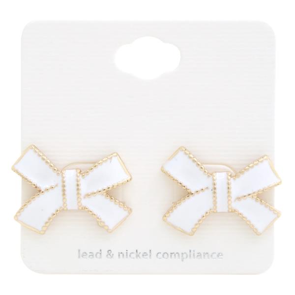 Rhinestone & Metal Bow Earrings feature elegant white bows with gold edges. Sizes: One size. Lead & nickel compliant.