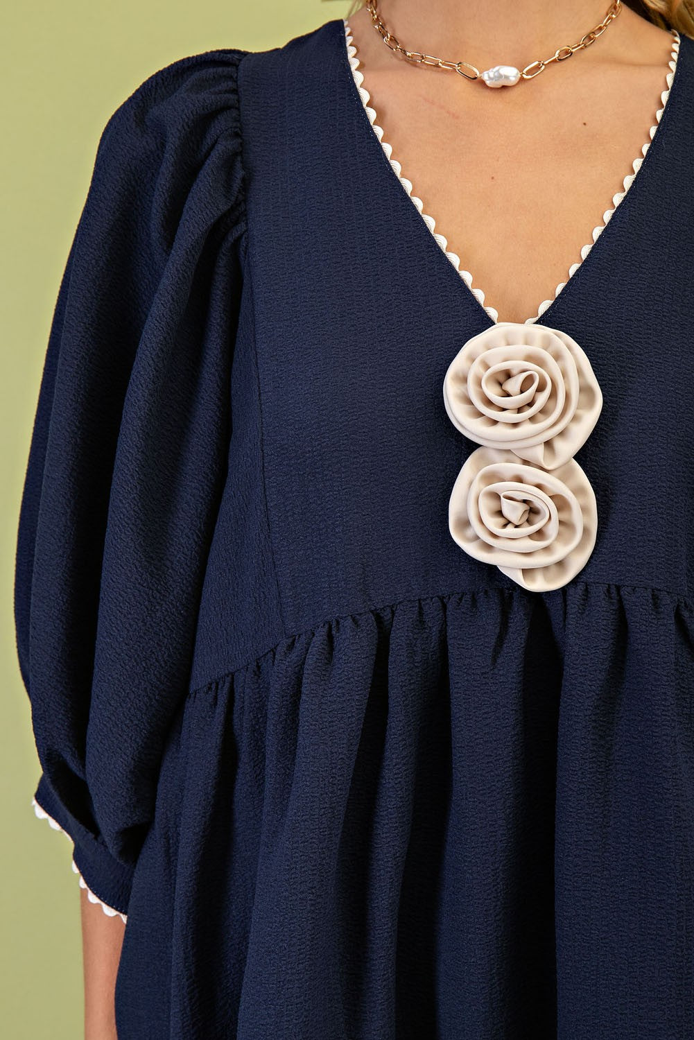 Rosette Adorned V-Neck Mini Dress: Navy blue with cream rosettes, puff sleeves. Sizes available: XS, S, M, L.